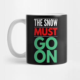 the snow must go on Mug